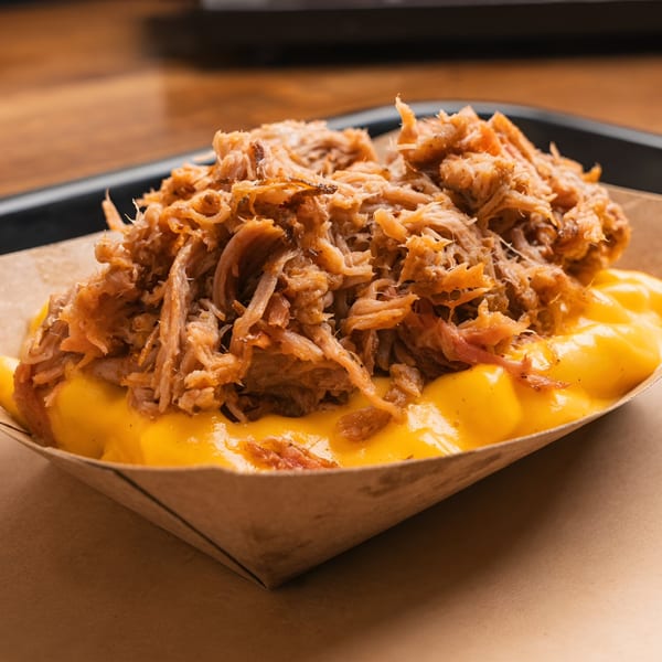 Double D's Southern BBQ mac and cheese topped with a generous portion of pulled pork.